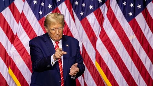 Republican presidential candidate and former president Donald Trump points to the audience after speaking at his campaign rally at Forum River Center in Rome on Saturday, March 9, 2024. (Arvin Temkar / arvin.temkar@ajc.com)