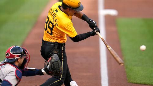 Pittsburgh Pirates' Nick Gonzales (39) hits a two-run single off Atlanta Braves starting pitcher Ray Kerr during the first inning of a baseball game in Pittsburgh, Friday, May 24, 2024. (AP Photo/Gene J. Puskar)