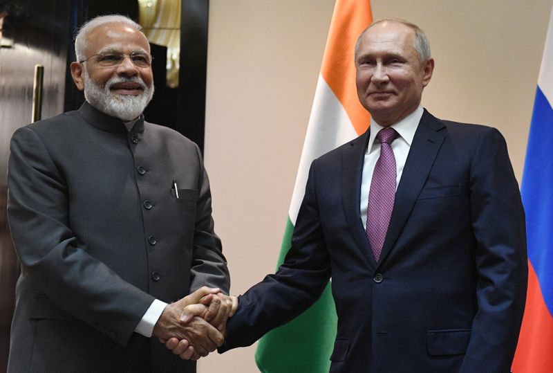 FILE- Russian President Vladimir Putin, right, and Indian Prime Minister Narendra Modi pose for a photo prior to their talks on a sideline of the Shanghai Cooperation Organization summit in Bishkek, Kyrgyzstan, June 13, 2019. Putin will this week participate in his first multilateral summit since an armed rebellion rattled Russia. Analysts say his participation at a virtual summit of the Shanghai Cooperation Organization on Tuesday is an opportunity to show he is in control after a short-lived insurrection by Wagner mercenary chief Yevgeny Prigozhin. (Grigory Sysoyev, Sputnik, Kremlin Pool Photo via AP, File)