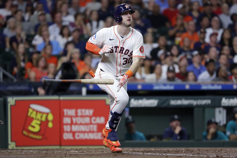 Houston Astros' Kyle Tucker flips his bat as he watches his solo home run during the fourth inning of a baseball game against the Seattle Mariners, Tuesday, Sept. 24, 2024, in Houston. (AP Photo/Michael Wyke)