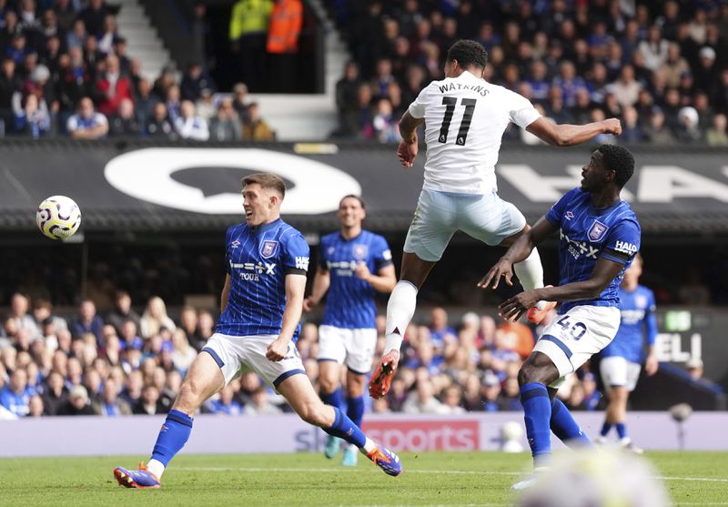 Aston Villa's Ollie Watkins scores his side's second goal during the British Premier League soccer match between Ipswich Town and Aston Villa at Portman Road, Ipswich, England, Sunday Sept. 29, 2024. (Zac Goodwin/PA via AP)