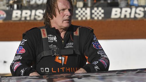 FILE - Scott Bloomquist stands beside his car before the Super Late Model division race at the Karl Kustoms Bristol Dirt Nationals, April 1, 2022, at Bristol Motor Speedway in Bristol, Tenn. (David Crigger/Bristol Herald Courier via AP, File)