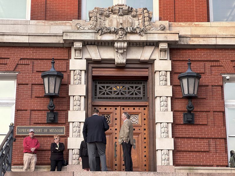 People gather outside the Missouri Supreme Court building on Tuesday, Sept. 10, 2024, in Jefferson City, Mo., in advance of oral arguments on whether to remove an abortion rights constitutional amendment from the general election ballot. (AP Photo/David A. Lieb)