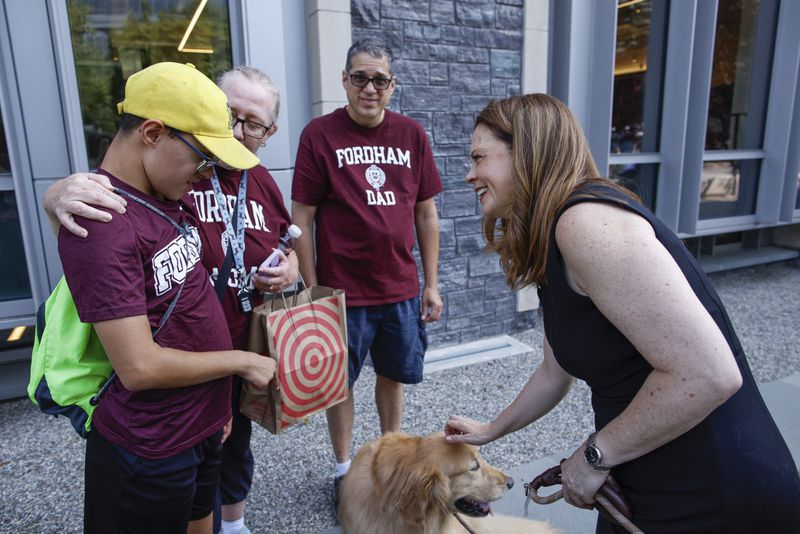 Tania Tetlow, president of Fordham University, meets families from New students during Move In Day at the Bronx campus, Sunday, Aug. 25, 2024, in New York. (AP Photo/Kena Betancur)