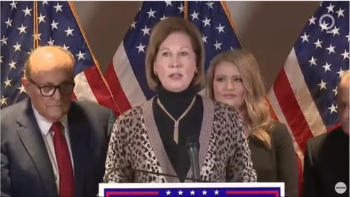 Trump attorney Sidney Powell promised to "release the kraken" of election fraud claims during a December 2020 announcement with other Trump attorneys such as Rudy Giuliani, left, and Jenna Ellis, right.