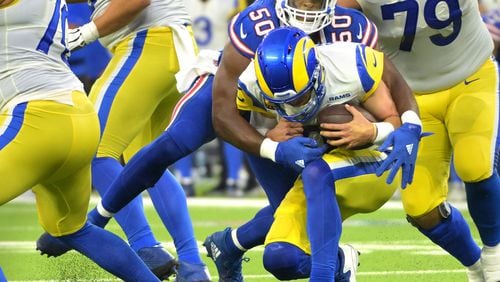 Los Angeles Rams quarterback Matthew Stafford is sacked by Buffalo Bills defensive end Greg Rousseau (50) in the third quarter at SoFi Stadium on Thursday, Sept. 8, 2022, in Inglewood, California. (Wally Skalij/Los Angeles Times/TNS)