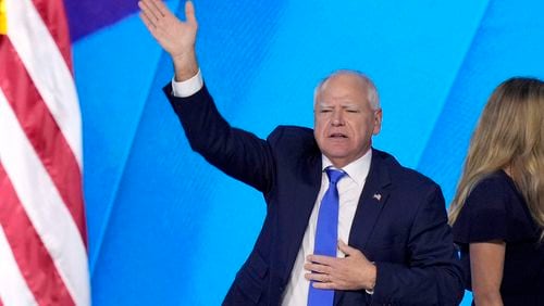 Democratic vice presidential nominee Minnesota Gov. Tim Walz, waves to the crowd after speaking during the Democratic National Convention Wednesday, Aug. 21, 2024, in Chicago. (AP Photo/J. Scott Applewhite)