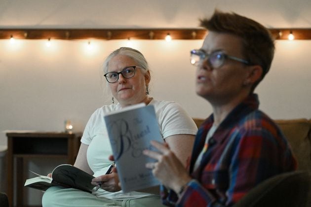 Candace Rowell (right), organizer, and Jessica Perlove discuss "The Bluest Eye" by Toni Morrison this month with other participants, who have joined online, at a banned book club meeting at Virginia-Highland Church, Thursday, September 19, 2024, in Atlanta. (Hyosub Shin / AJC)