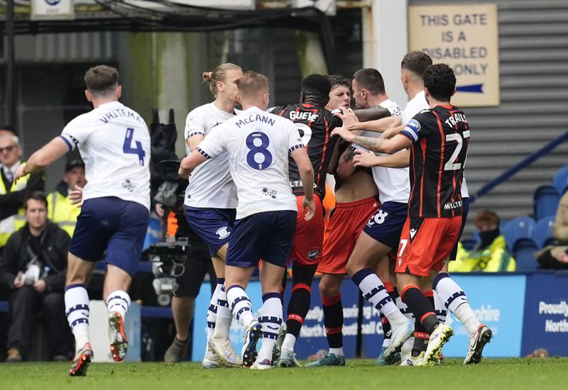 Blackburn Rovers' Owen Beck is confronted by Preston North End's Milutin Osmajic before being shown a red card, during an English Football League soccer match, at Deepdale, in Preston, England, Sunday, Sept. 22, 2024. (Nick Potts/PA via AP)