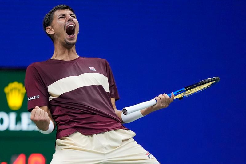 Alexei Popyrin, of Australia, reacts Novak Djokovic, of Serbia,during a third round match of the U.S. Open tennis championships, Friday, Aug. 30, 2024, in New York. (AP Photo/Julia Nikhinson)