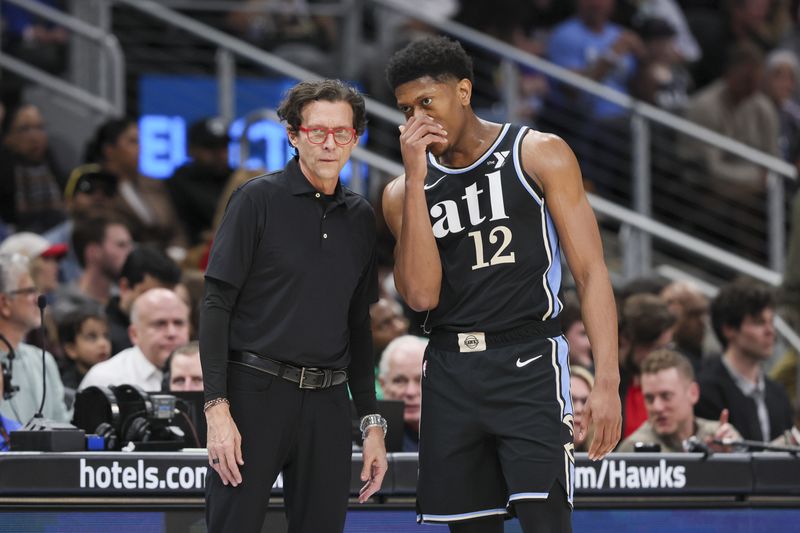 Atlanta Hawks head coach Quin Snyder talks with Atlanta Hawks forward De'Andre Hunter (12) during the second half against the Los Angeles Lakers at State Farm Arena, Tuesday, January 30, 2024, in Atlanta. The Hawks won 138-122. (Jason Getz / jason.getz@ajc.com)