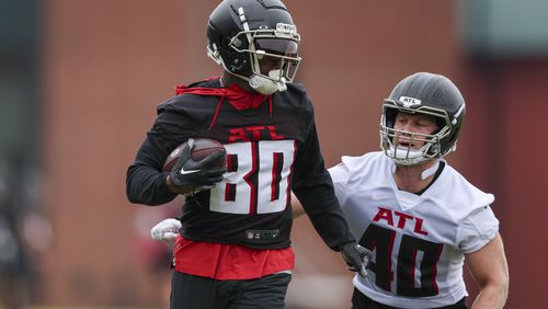 Atlanta Falcons wide receiver Josh Ali (80) runs after a catch against linebacker JD Bertrand (40) during minicamp at the Atlanta Falcons Training Camp, Tuesday, May 14, 2024, in Flowery Branch, Ga. (Jason Getz / AJC)
