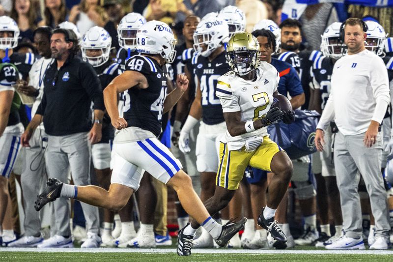 Georgia Tech Yellow Jackets wide receiver Eric Singleton Jr. (2) runs down the sidelines after a punt return in the first quarter of a football game against the Duke BlueDevils, Saturday, Oct. 5, 2024, in Atlanta. (AP Photo/Jason Allen)