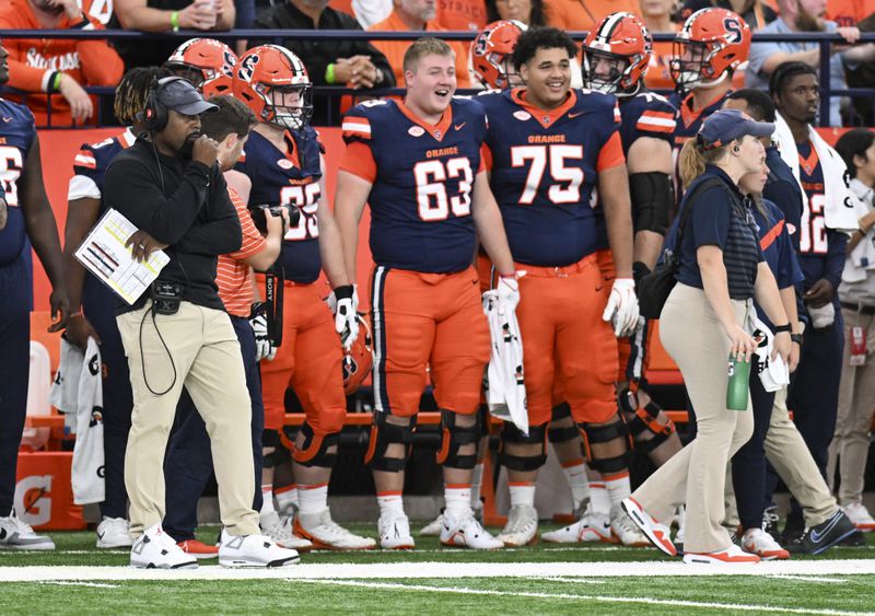 Syracuse head coach Fran Brown, left, watches his team play Georgia Tech during the first half of an NCAA football game on Saturday, Sept. 7, 2024 in Syracuse, N.Y. (AP Photo/Hans Pennink)