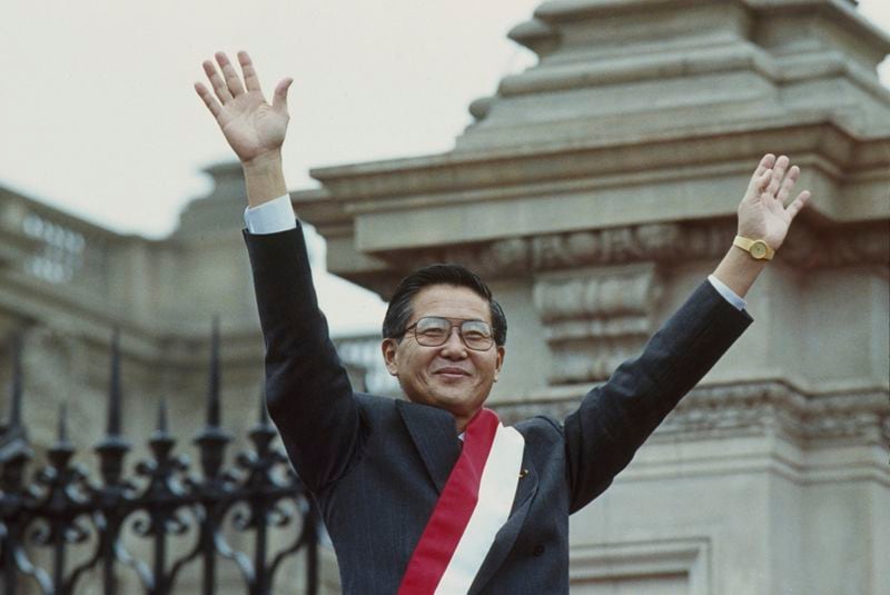 FILE - New Peruvian President Alberto Fujimori waves to supporters at the government palace, July 28, 1990. (AP Photo/Alejandro Balaguer, File)