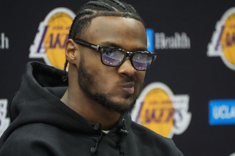 Los Angeles Lakers draft pick Bronny James listens to questions from the media during the NBA basketball team's news conference in El Segundo, Calif., Tuesday, July 2, 2024. (AP Photo/Damian Dovarganes)