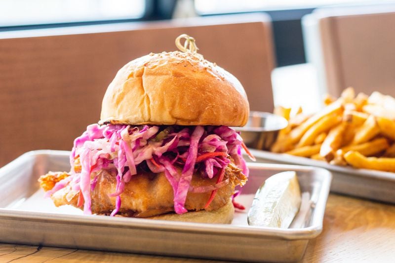 Big Kahuna beer-battered fish sandwich with Calabrian chili aioli and fennel slaw. CONTRIBUTED BY HENRI HOLLIS