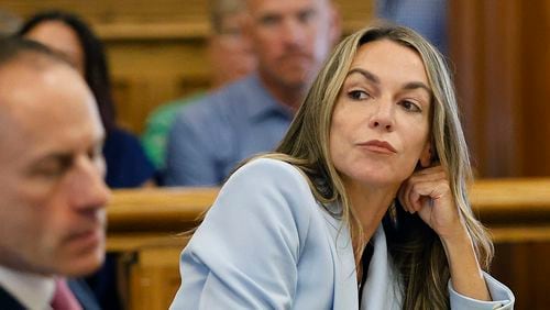 Karen Read listens to her attorney, Martin Weinberg, who was making motions to dismiss two charges against her, at Norfolk Superior Court in Dedham, Mass., Friday, Aug. 9, 2024. (Greg Derr/The Patriot Ledger via AP, Pool)