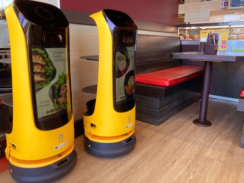 Robots assist waitstaff at Kura Revovling Sushi. / Courtesy of Kura Revolving Sushi