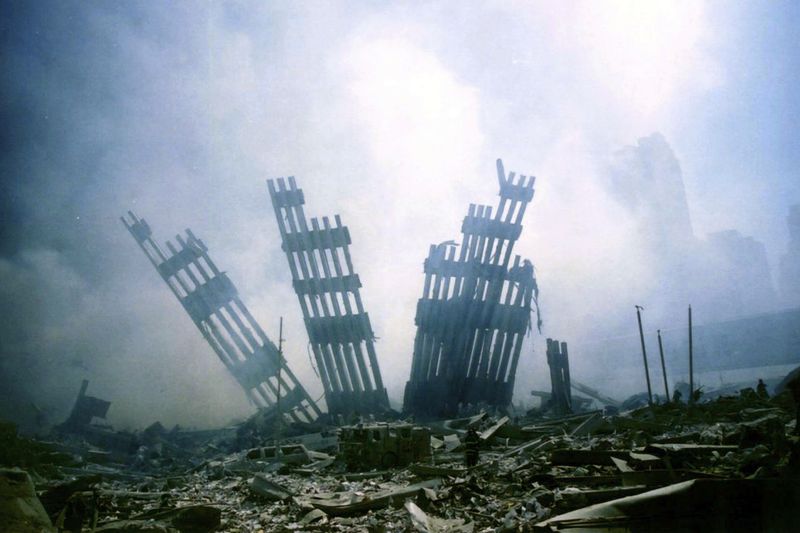 FILE - The remains of the World Trade Center stand amid other debris following the terrorist attack on the buildings in New York, Sept. 11, 2001. (AP Photo/Alexandre Fuchs, File)