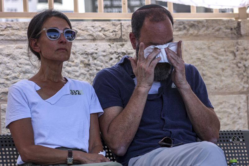 Jonathan Polin and Rachel Goldberg, parents of Israeli-American hostage Hersh Goldberg-Polin, who was killed in Hamas captivity in the Gaza Strip, attend their son's funeral in Jerusalem, Monday, Sept. 2, 2024. (Gil Cohen-Magen/Pool via AP)