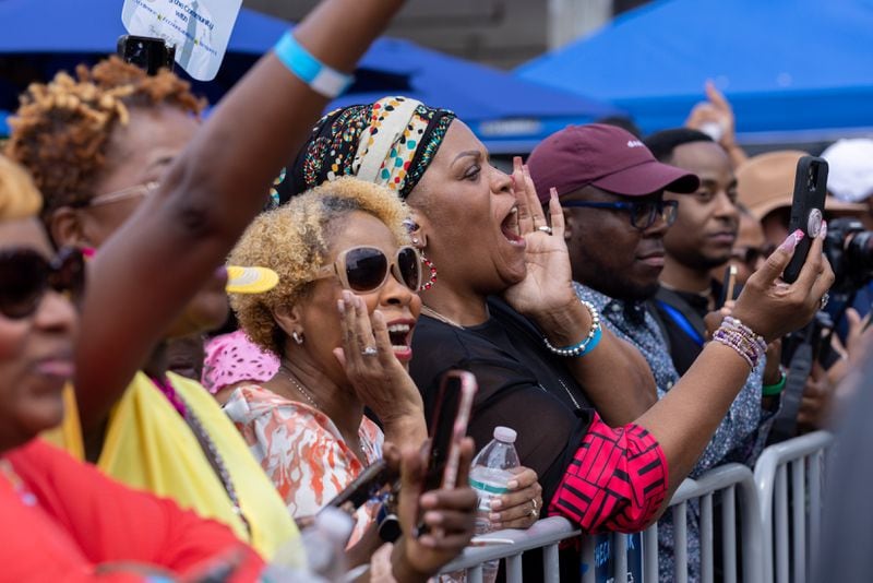 Supporters cheer for Vice President Kamala Harris at a Juneteenth Block Party campaign event outside her new campaign headquarters in Atlanta on Tuesday, June 18, 2024. (Arvin Temkar / AJC)