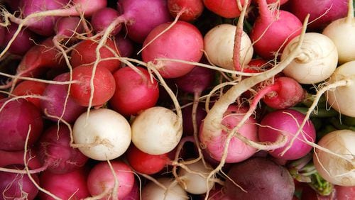 Fresh radishes on sale at local farmers market. (Dreamstime/TNS)