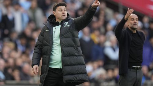 FILE - Chelsea's head coach Mauricio Pochettino, left, and Manchester City's head coach Pep Guardiola gesture during the English FA Cup semifinal soccer match between Manchester City and Chelsea at Wembley stadium in London, Saturday, April 20, 2024. (AP Photo/Alastair Grant)