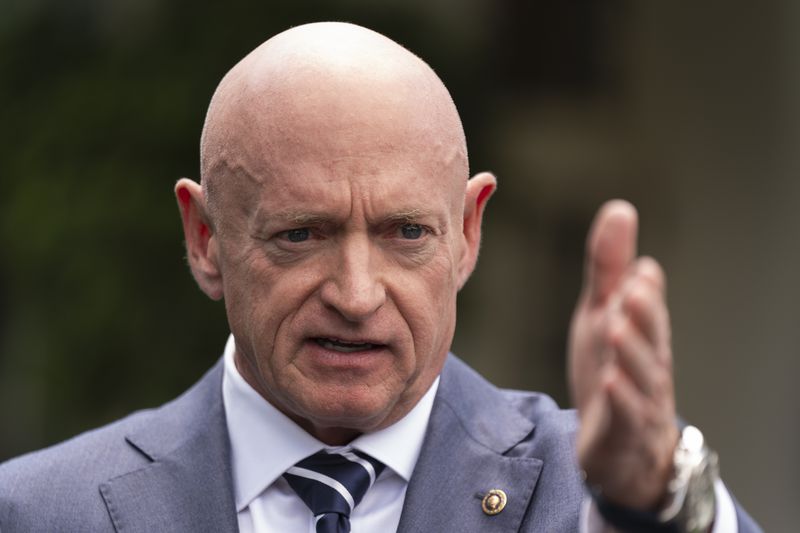 Sen. Mark Kelly, D-Ariz., speaks about the southern border outside the West Wing of the White House, Tuesday, June 4, 2024, in Washington. (AP Photo/Manuel Balce Ceneta)