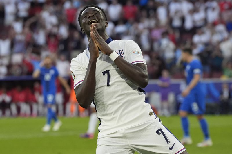England's Bukayo Saka reacts after his goal was disallowed during a Group C match between England and Slovenia at the Euro 2024 soccer tournament in Cologne, Germany, Tuesday, June 25, 2024. (AP Photo/Martin Meissner)