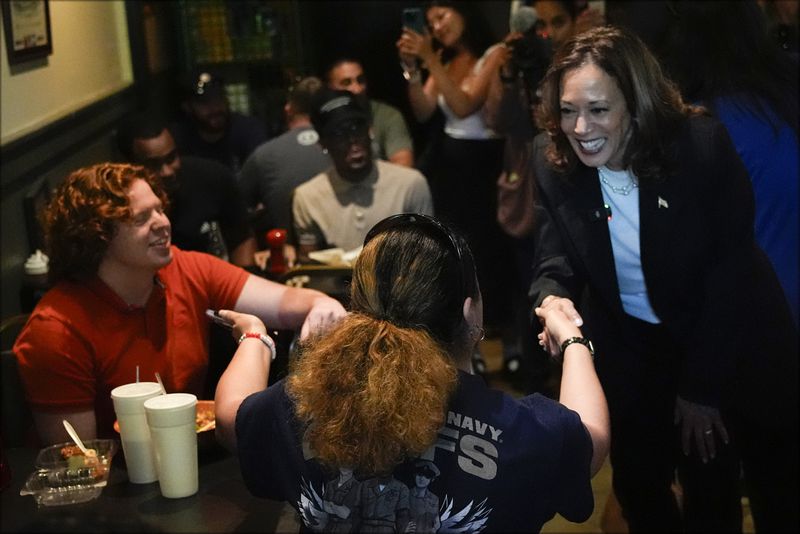 Democratic presidential nominee Vice President Kamala Harris talks as she visits SandFly Bar-B-Q in Savannah, Ga., Wednesday, Aug. 28, 2024. (AP Photo/Jacquelyn Martin)