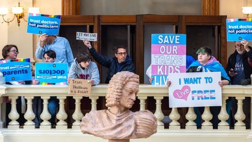 Opponents of Senate Bill 140, a bill that would prevent medical professionals from giving transgender children certain hormones or surgical treatment, gather in March in the Georgia Capitol. The General Assembly later approved the measure. (Arvin Temkar / arvin.temkar@ajc.com)