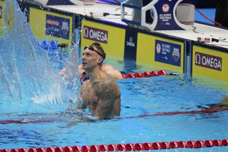 Caeleb Dressel reacts after winning the Men's 100 butterfly finals Saturday, June 22, 2024, at the US Swimming Olympic Trials in Indianapolis. (AP Photo/Darron Cummings)