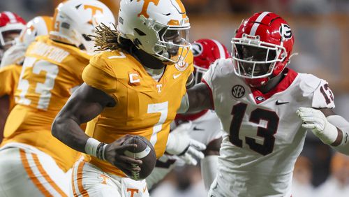 Georgia defensive lineman Mykel Williams (13) sacks Tennessee quarterback Joe Milton III (7) during the third quarter at Neyland Stadium, Saturday, November 18, 2023, in Knoxville, Tn. Georgia won 38-10. (Jason Getz / Jason.Getz@ajc.com)