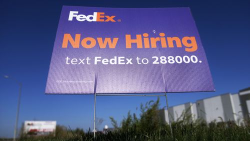 A hiring sign for employment at FedEx is seen, Wednesday, Sept. 4, 2024, in Grimes, Iowa. (AP Photo/Charlie Neibergall)