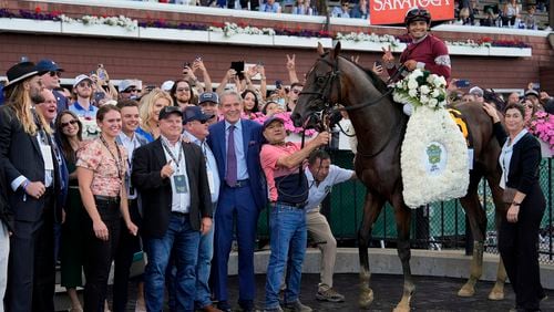 Dornoch, (6), with Luis Saez up, stands in the winner's circle after winning the 156th running of the Belmont Stakes horse race, Saturday, June 8, 2024, in Saratoga Springs, N.Y. Dornoch is part of West Paces Racing LLC, a group founded by Atlantans Keith Mason and Larry Connolly in 2019. (AP Photo/Julia Nikhinson)