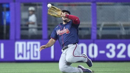 Atlanta Braves left fielder Ramón Laureano catches a ball hit by Miami Marlins' Jesús Sánchez during the fourth inning of a baseball game, Sunday, Sept. 22, 2024, in Miami. (AP Photo/Wilfredo Lee)