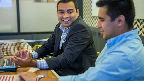 Jaime Rangel (left), a recipient of Deferred Action for Childhood Arrivals, works as an organizing intern with Sam Aguilar at Fwd.Us in Atlanta. (Photo by Phil Skinner)