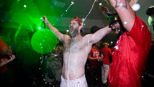 Philadelphia Phillies' Bryce Harper celebrates after the Phillies won a baseball game against the Chicago Cubs to clinch the NL East title, Monday, Sept. 23, 2024, in Philadelphia. (AP Photo/Matt Slocum)