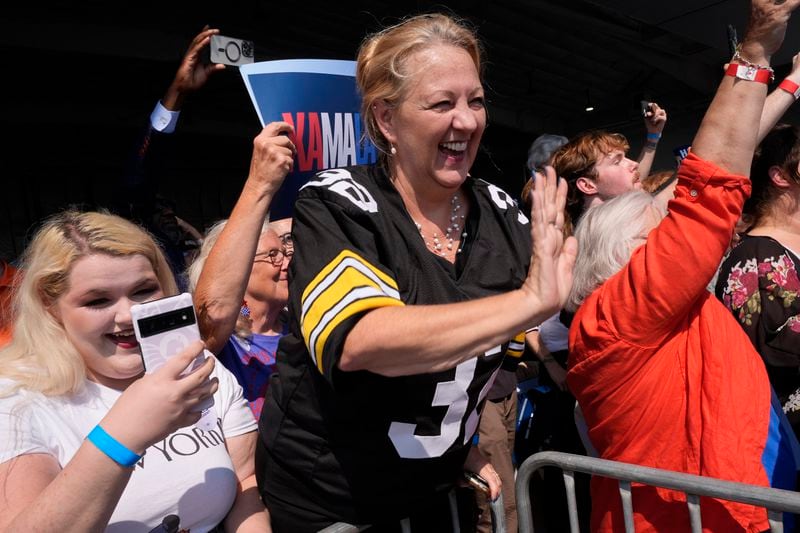 Supporters wave as Democratic presidential nominee Vice President Kamala Harris arrives at John Murtha Johnstown-Cambria Airport, in Johnstown, Pa., for a campaign event, Friday, Sept. 13, 2024. (AP Photo/Jacquelyn Martin)