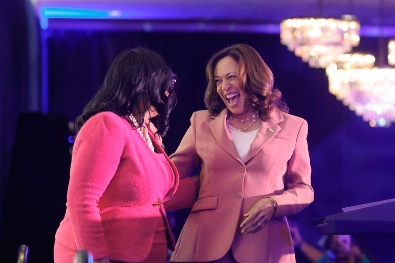 U.S. Rep. Nikema Williams, left, shares a laugh with Vice President Kamala Harris at a state Democratic Party function in May. Williams said Democrats have work to do to ensure President Joe Biden is reelected. “Until people understand they’re reaping the benefits coming directly from the Biden-Harris agenda, we haven’t completed our job.” (Natrice Miller/ Natrice.miller@ajc.com)