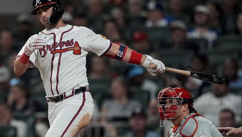 Philadelphia Phillies first base Bryce Harper holds his arm after betting hit by a pitch in the first inning of a baseball game against the Toronto Blue Jays in Toronto, Wednesday, Sept. 4, 2024. (Cole Burston/The Canadian Press via AP)