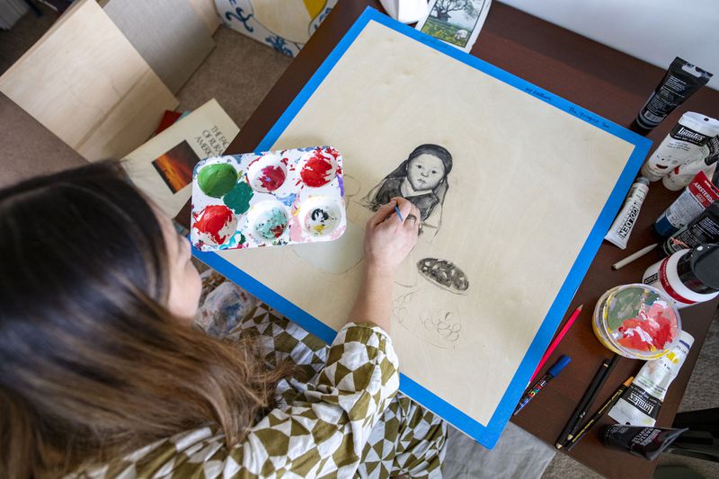 Nicole Kang working on a new painting. (Photo Courtesy of Isadora Pennington)