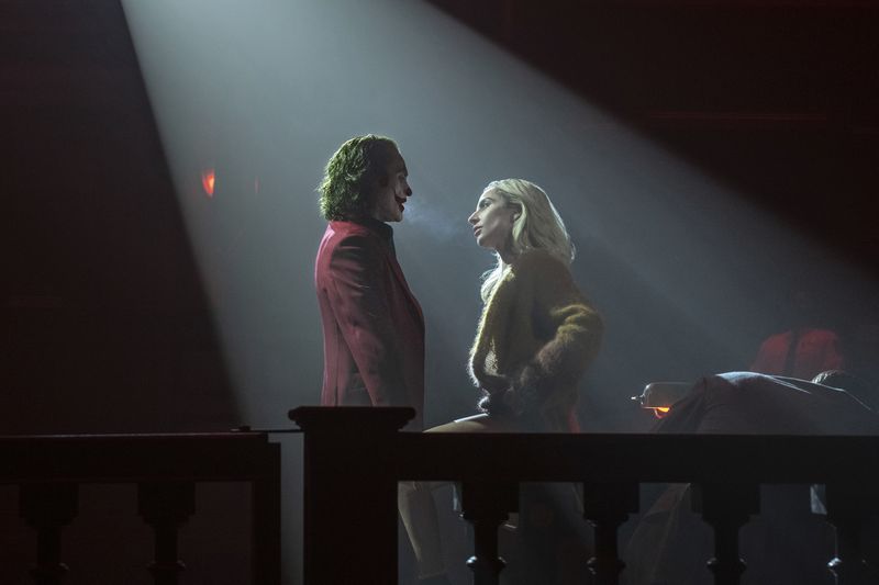 This image released by Warner Bros. Pictures shows Joaquin Phoenix, left, and Lady Gaga in a scene from "Joker: Folie à Deux." (Niko Tavernise/Warner Bros. Pictures via AP)