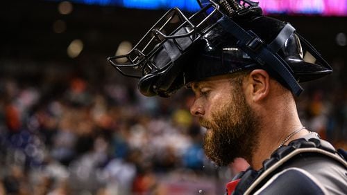 Braves catcher Brian McCann walks off the field in the tenth inning against the Miami Marlins Aug. 10, 2019, at Marlins Park in Miami.