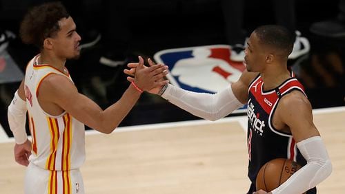Wizards' Russell Westbrook is congratulated by Hawks' Trae Young after an NBA basketball game Monday, May 10, 2021, in Atlanta. Westbrook recorded his 182nd career triple-double, passing Oscar Robertson for the most in NBA history.