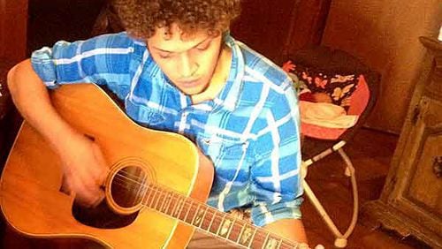 Quentin Muse, 20, taught himself how to play guitar, his co-worker and friend said. (Special photo)