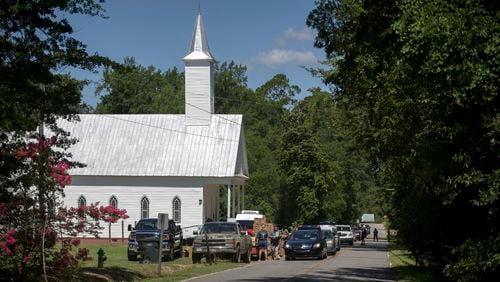 The line stretched down the street at the recent food drive at the Summertown Food Pantry. (AJC Photo/Stephen B. Morton)