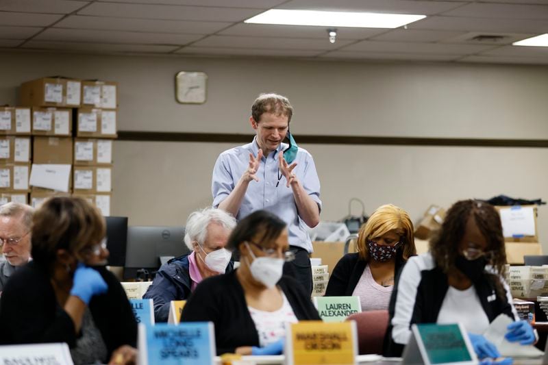 Election officials give directions to poll workers during the recount of the ballots at DeKalb County Voter Registration and Election office headquarters on Sunday, May 29. 2022.  Miguel Martinez / miguel.martinezjimenez@ajc.com