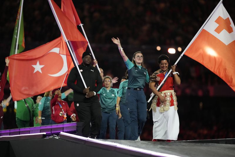 Athletes from different delegations parade during the closing ceremony of the 2024 Paralympics, Sunday, Sept. 8, 2024, in Paris, France. (AP Photo/Michel Euler)